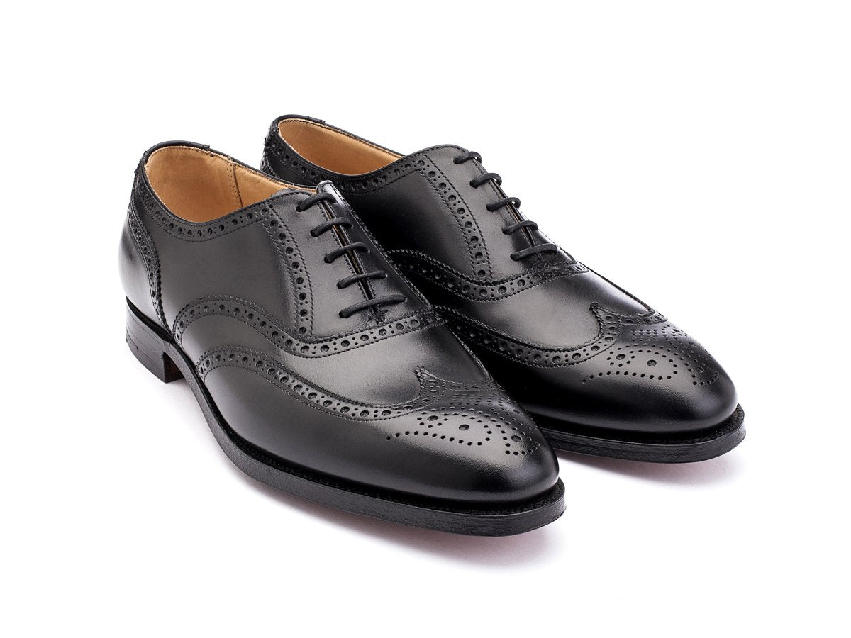 Front angle view of Crockett & Jones Finsbury wingtip full brogue oxford shoes in black calf