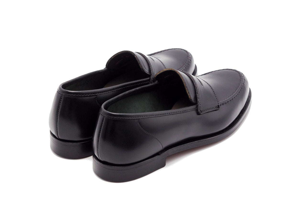 Back angle view of Crockett & Jones Harvard 2 penny loafers in black shell cordovan