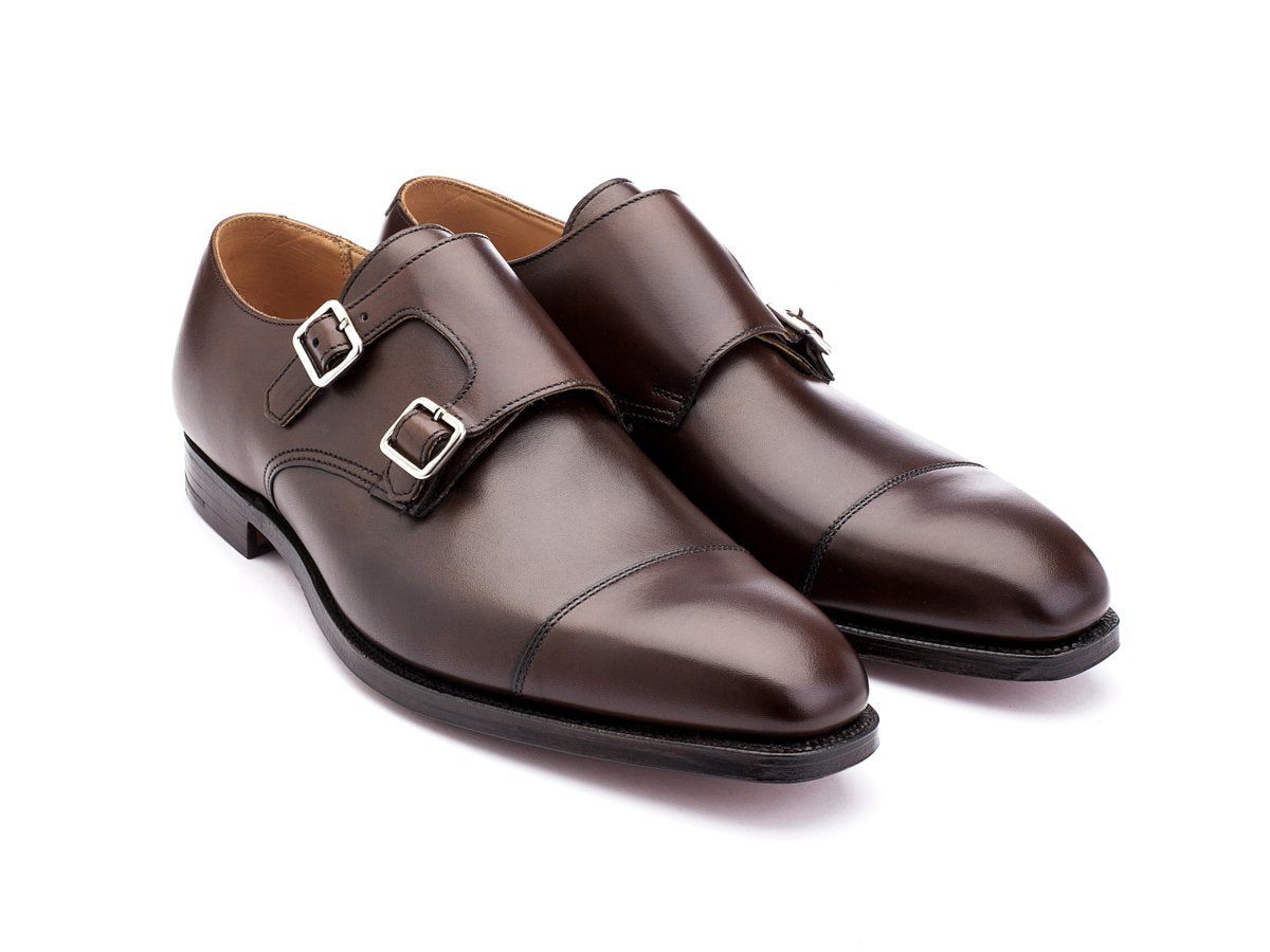 Front angle view of Crockett & Jones Lowndes captoe Shopovas strap shoes in dark brown burnished calf