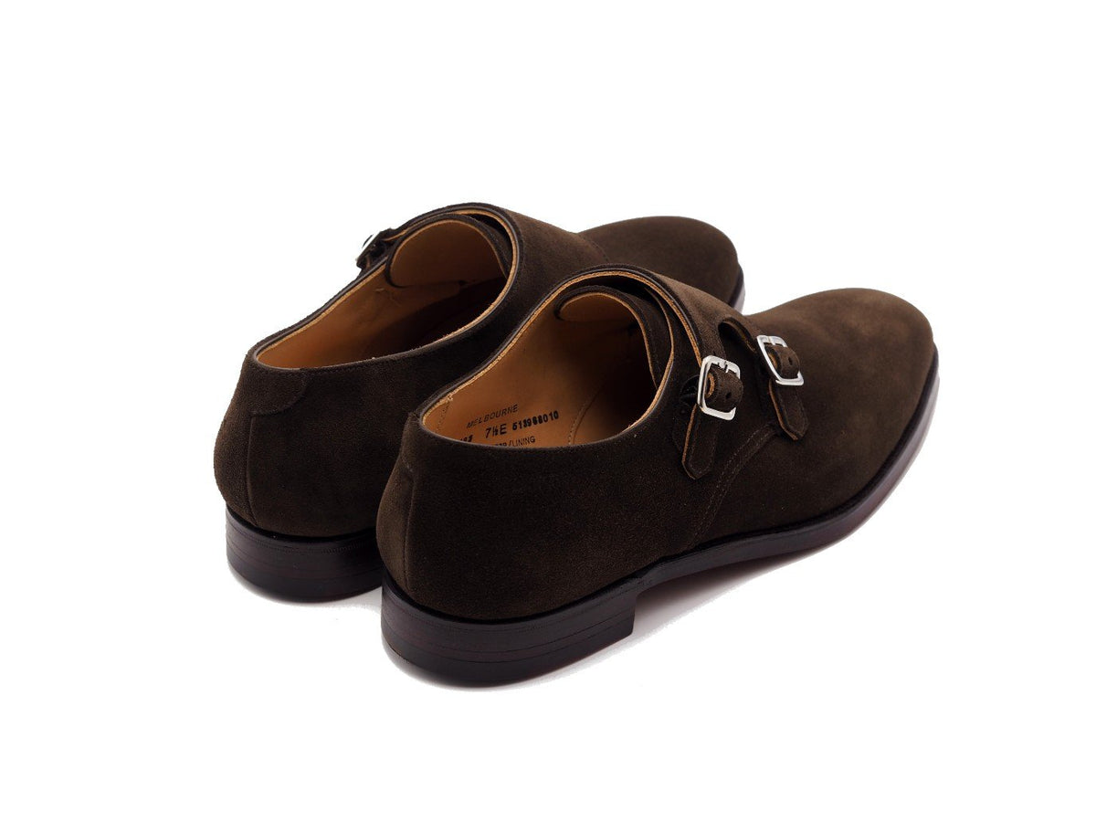 Back angle view of Crockett & Jones Melbourne plain toe Shopovas strap shoes in dark brown suede