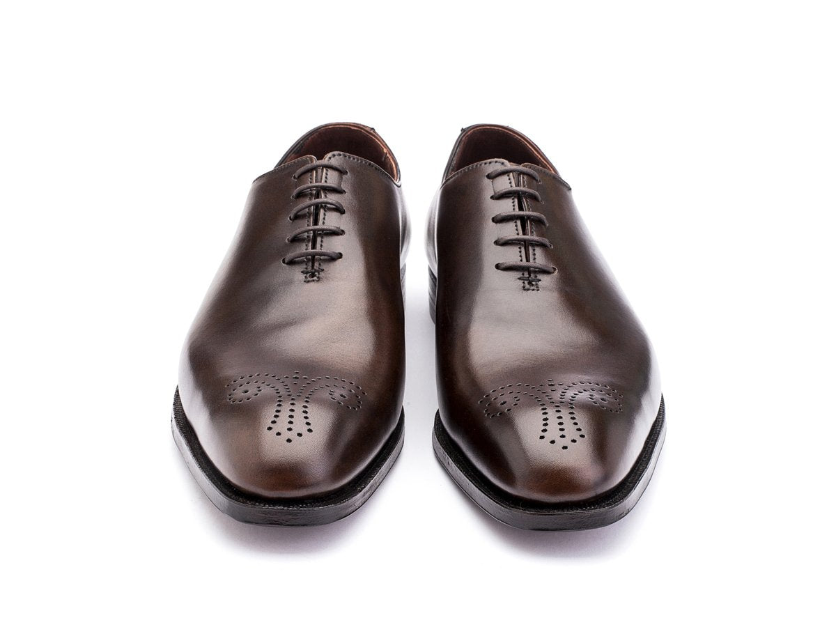 Front view of Crockett & Jones Weymouth wholecut medallion oxford shoes in dark brown antique calf