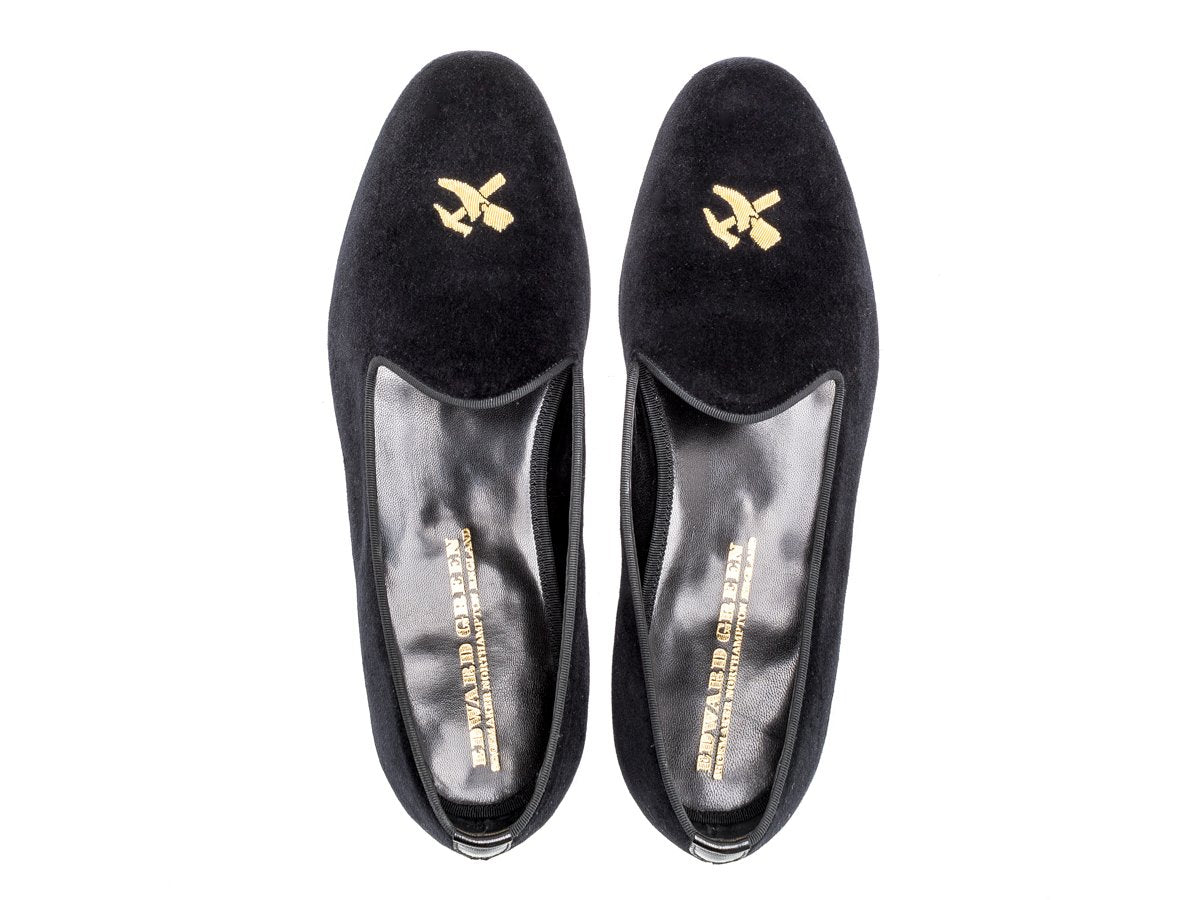 Top view of Edward Green Albert slippers in black velvet with hand embroidered gold Shopovas logo on toe