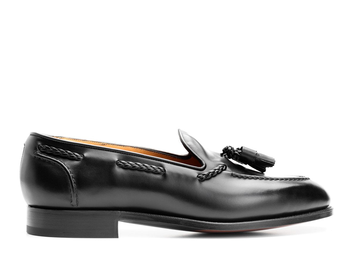 Side view of Edward Green Belgravia braided tassel loafers in black calf