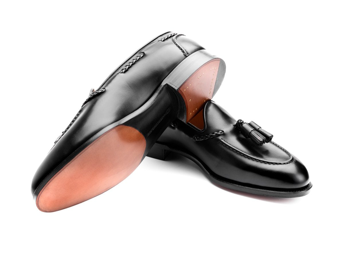 Leather sole of Edward Green Belgravia braided tassel loafers in black calf
