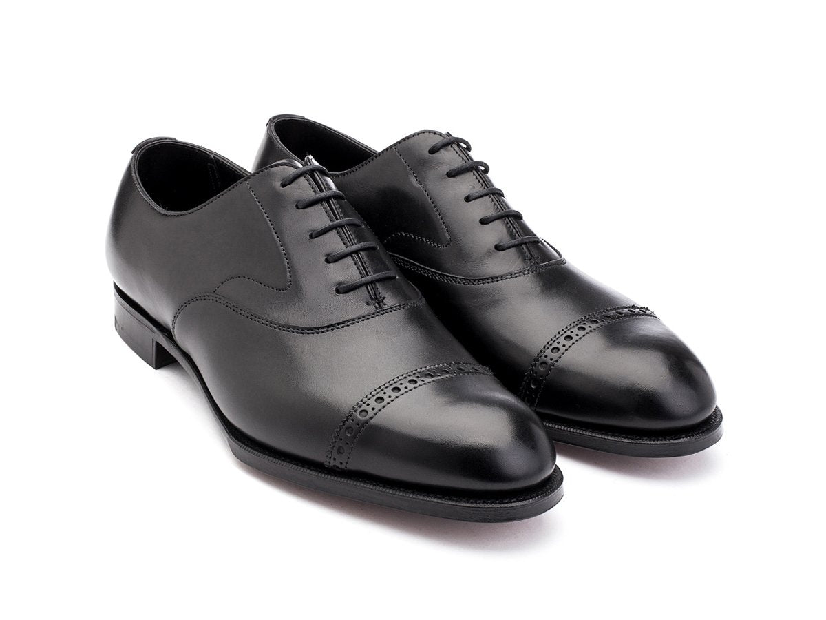 Front angle view of Edward Green Berkeley quarter brogue oxford shoes in black calf