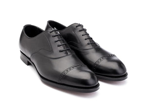 Front angle view of Edward Green Berkeley quarter brogue oxford shoes in black calf