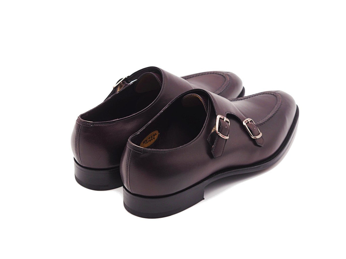 Back angle view of Edward Green Fulham split toe Shopovas strap shoes in nightshade antique calf