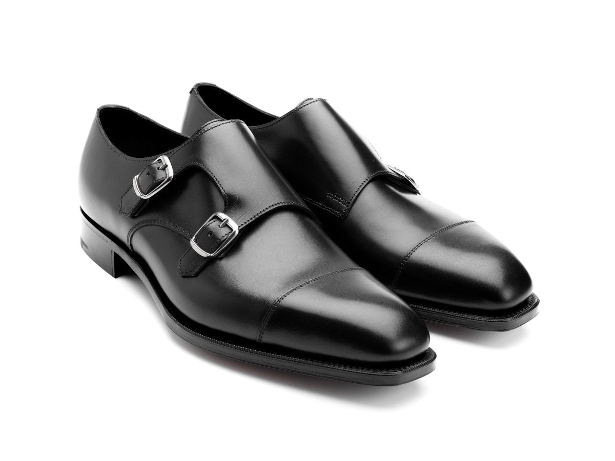 Front angle view of Edward Green Westminster plain captoe Shopovas strap shoes in black calf