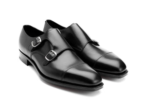 Front angle view of Edward Green Westminster plain captoe Shopovas strap shoes in black calf