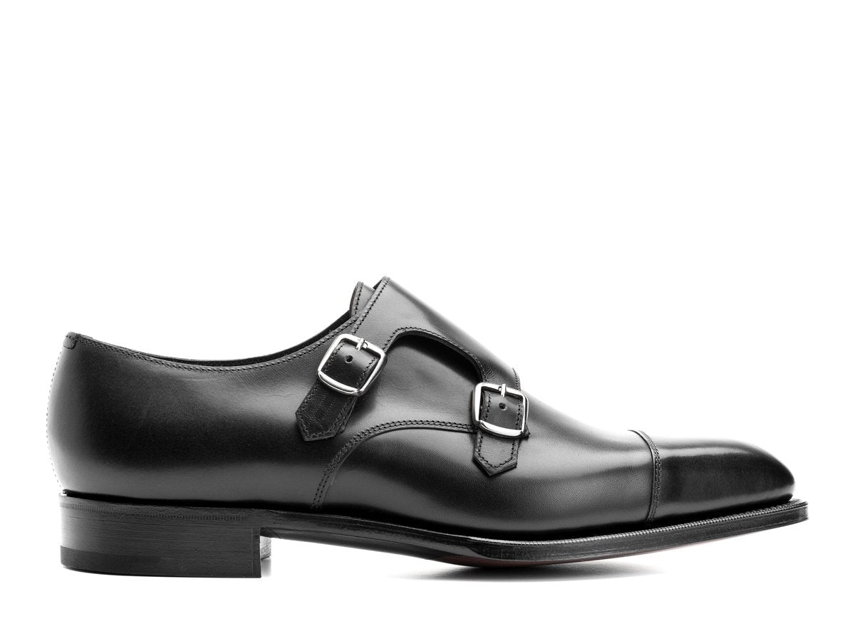Side view of Edward Green Westminster plain captoe Shopovas strap shoes in black calf