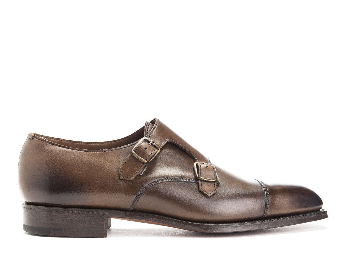 Side view of Edward Green Westminster plain captoe Shopovas strap shoes in dark oak antique calf