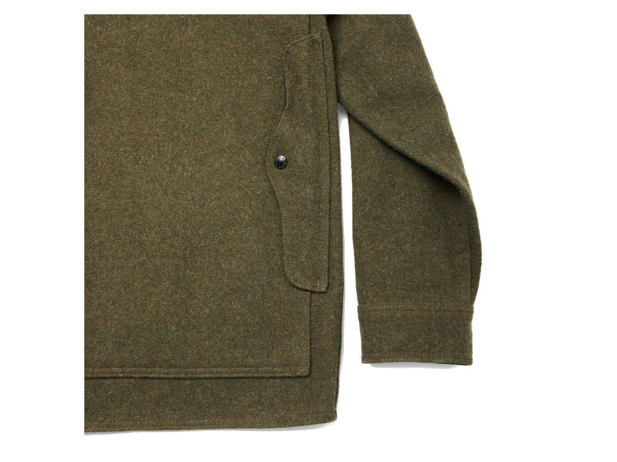 Close up view of Filson Mackinaw Cruiser jacket back pocket in forest green