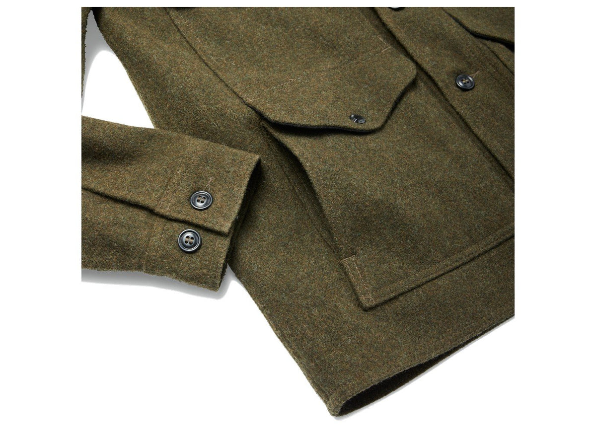 Close up view of Filson Mackinaw Cruiser jacket waist pocket in forest green