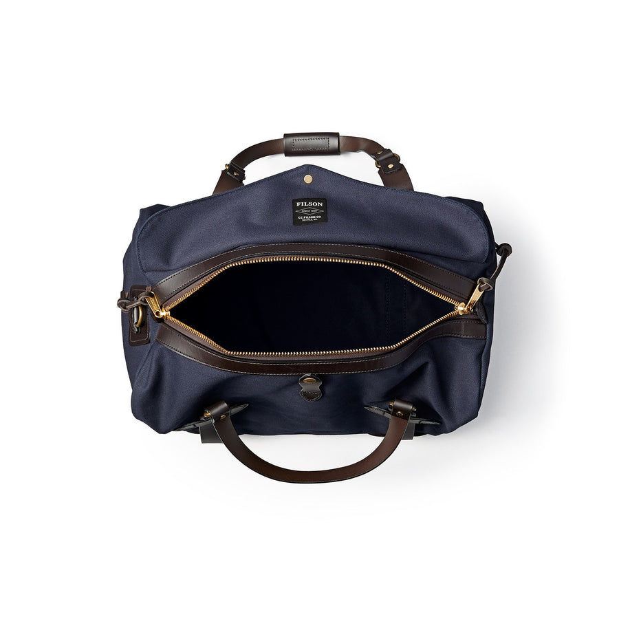 Top view of unzipped Filson Medium Duffle bag in navy