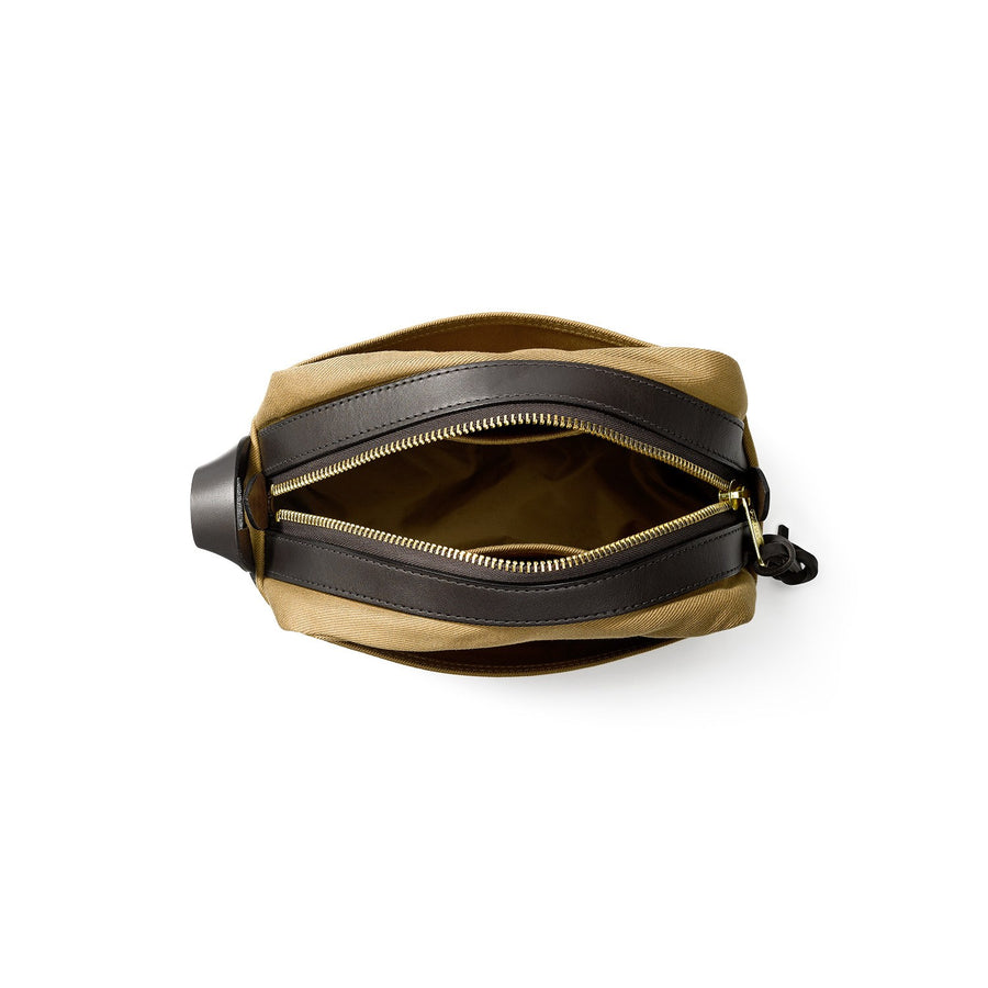 Top view of unzipped Filson Travel Kit bag in tan