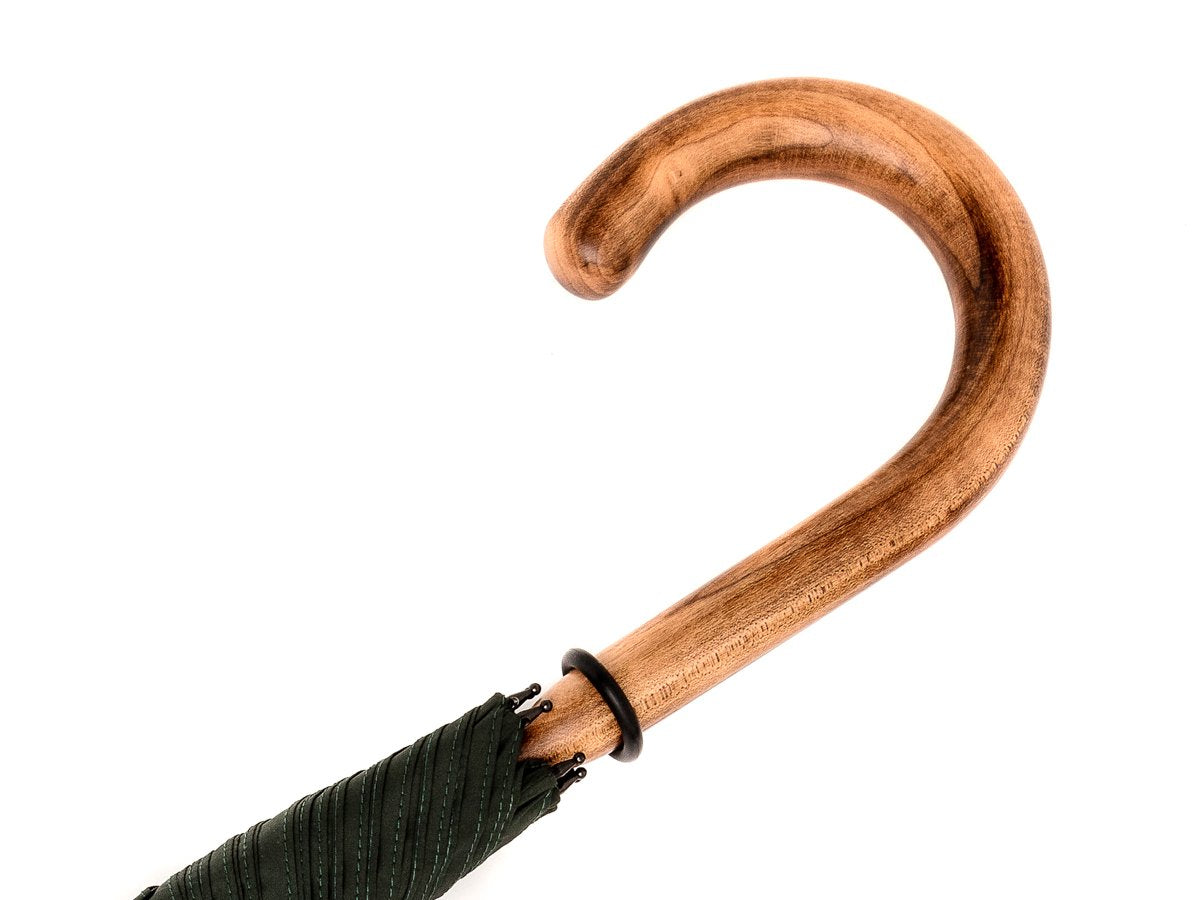 Handle of solid scorched maple Fox Umbrella with dark green canopy