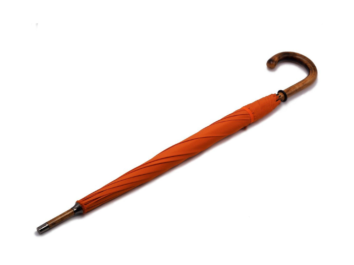 Full length view of solid scorched maple Fox Umbrella with orange canopy