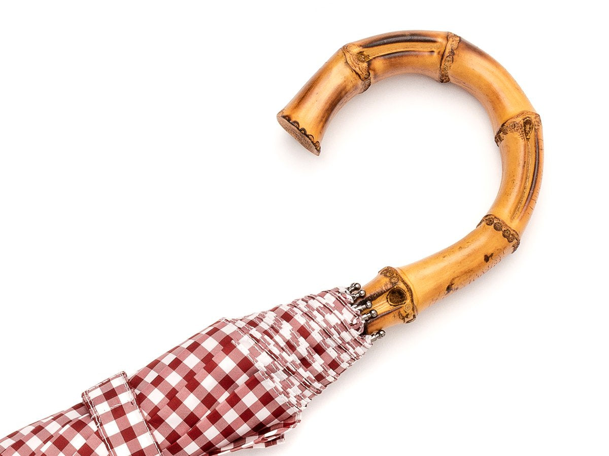 Whangee handle of telescopic Fox Umbrella with wine and white gingham canopy