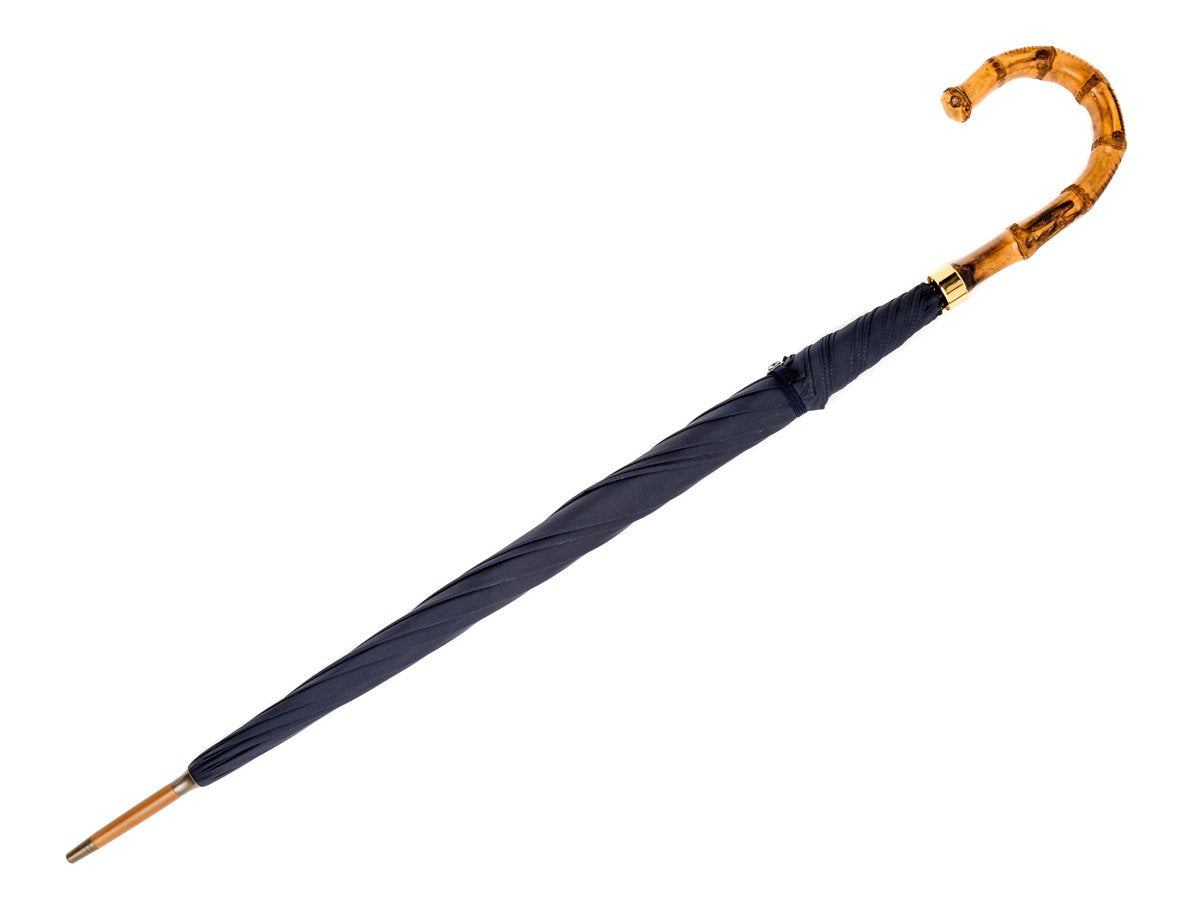 Full length view of whangee handle tube Fox Umbrella with navy canopy