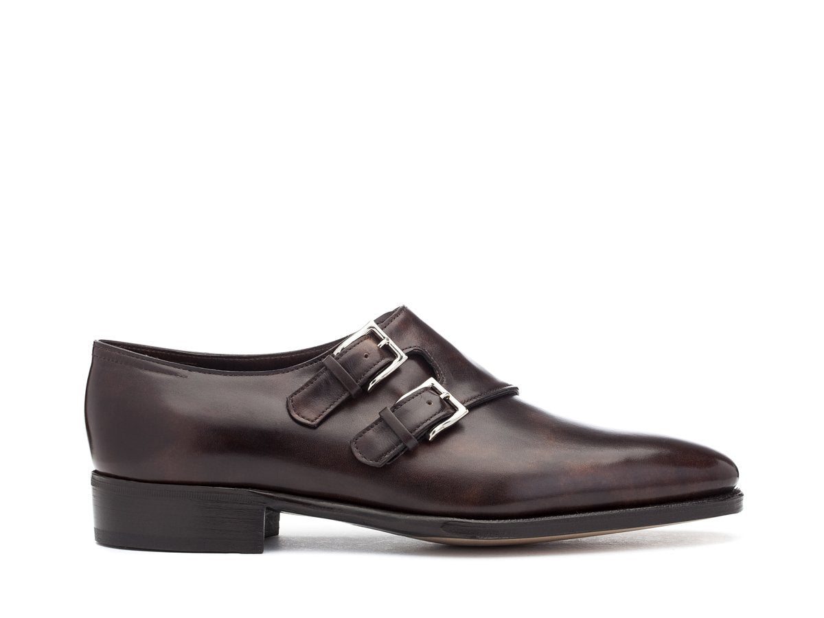 Side view of John Lobb Chapel plain toe swept back Shopovas strap shoes in dark brown museum calf