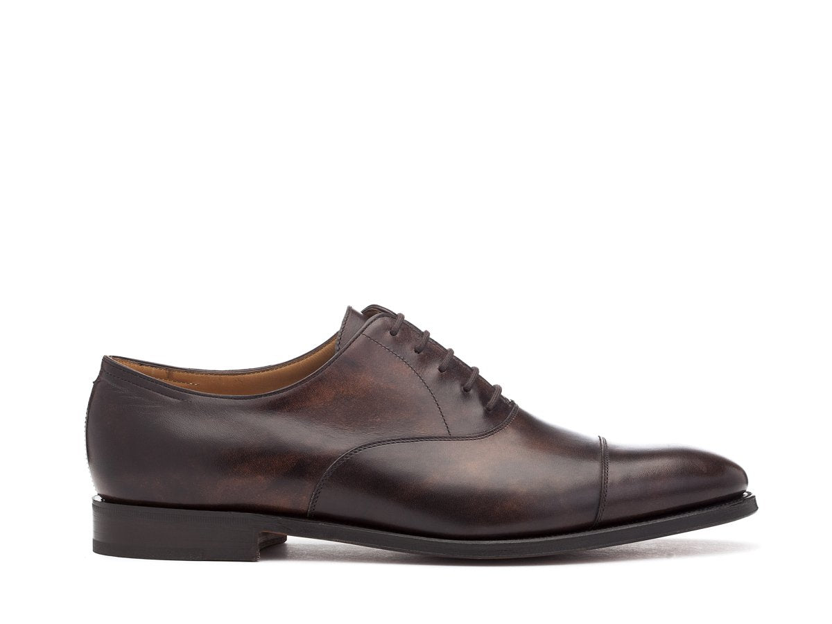 Side view of John Lobb City II plain captoe oxford shoes in dark brown museum calf