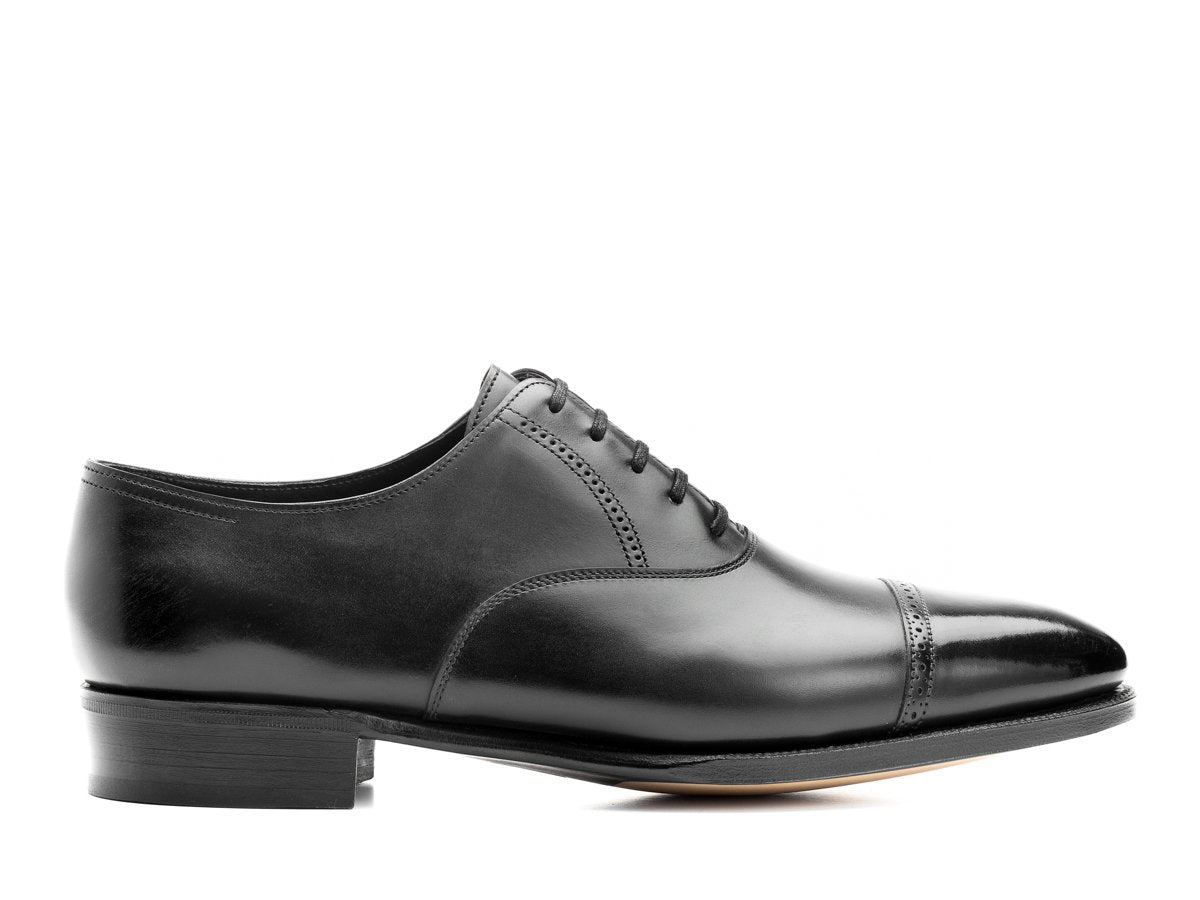 Side view of John Lobb Philip II quarter brogue oxford shoes in black oxford calf