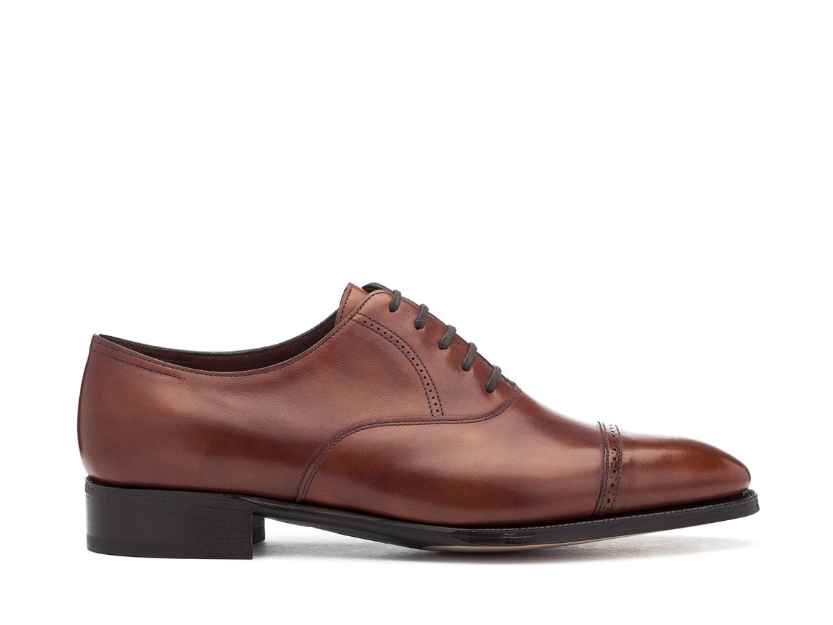 Side view of EE width John Lobb Philip II quarter brogue oxford shoes in chestnut misty calf