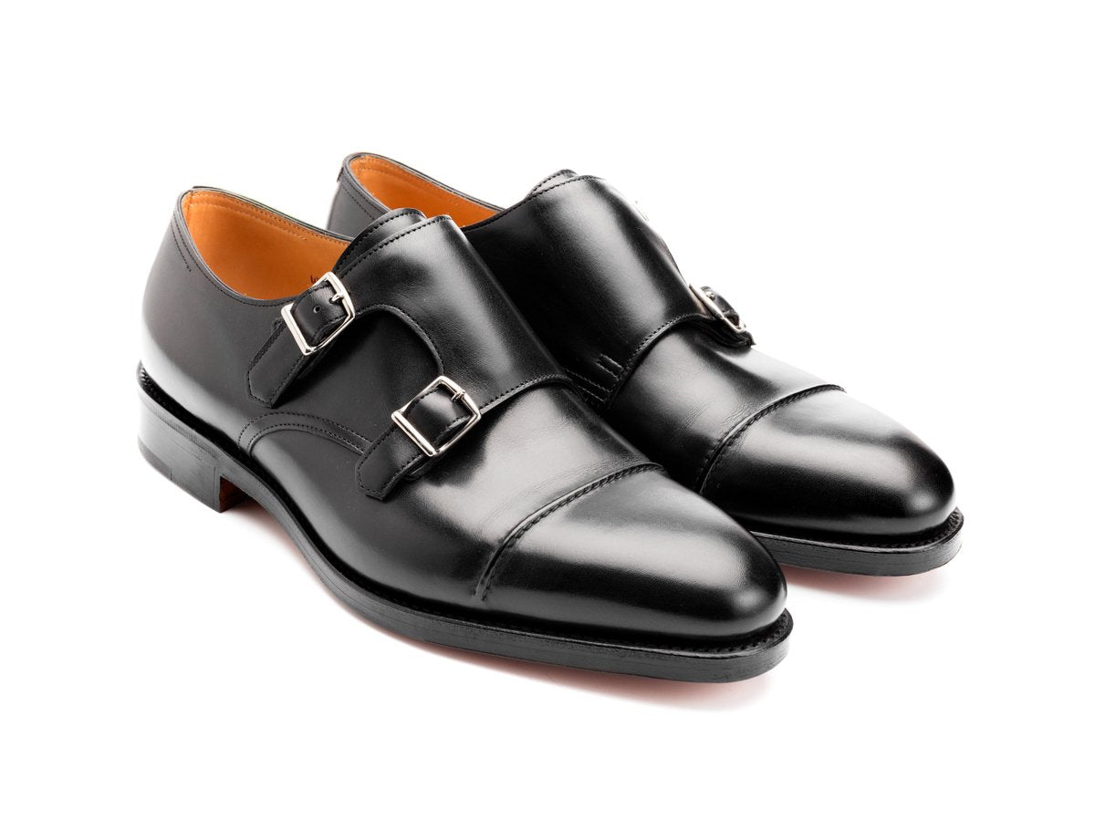 Front angle view of EE width John Lobb William II captoe Shopovas strap shoes in black calf