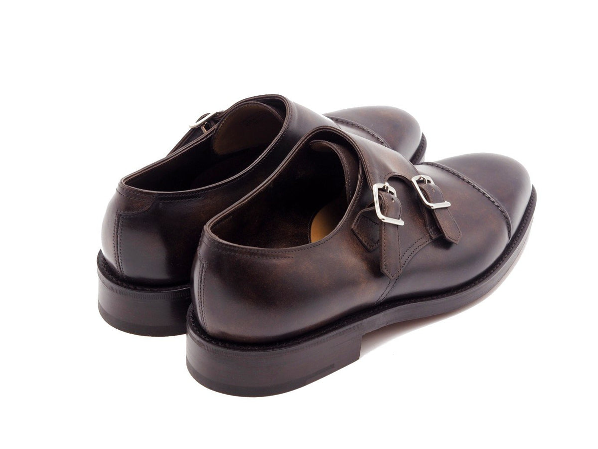 Back angle view of John Lobb William II captoe Shopovas strap shoes in dark brown museum calf