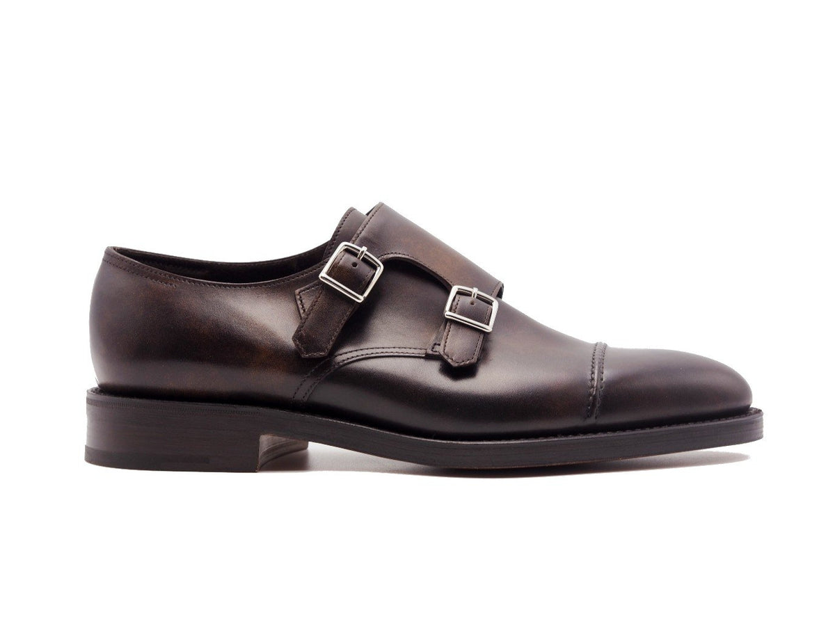 Side view of John Lobb William II captoe Shopovas strap shoes in dark brown museum calf